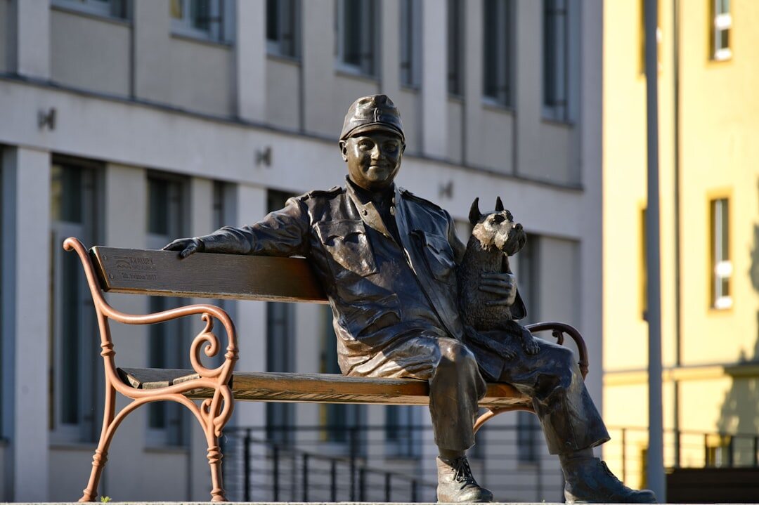 man sitting on bench with dog